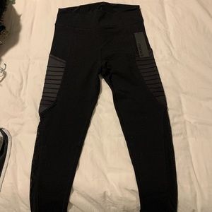 Black moto crop leggings with pockets on both legs